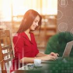 Businesswoman Working On Laptop In Coffee Shop. Young business woman uses laptop in cafe. Businesswoman working typing in a laptop. Business infographic